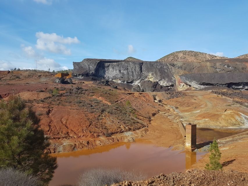 From Seville: Full-Day Aracena & Rio Tinto Mines Tour - Inside Gruta de las Maravillas: stalactites, stalagmites, and blue water