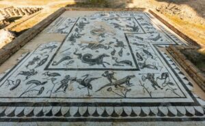 From Seville: Italica Roman City & Medieval Monastery Tour - Italica’s amphitheater: the Dragonpit moment and the scale lesson