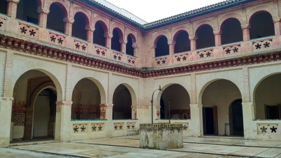 From Seville: Italica Roman City & Medieval Monastery Tour - Mosaics, streets, and the emperor-birthplace angle