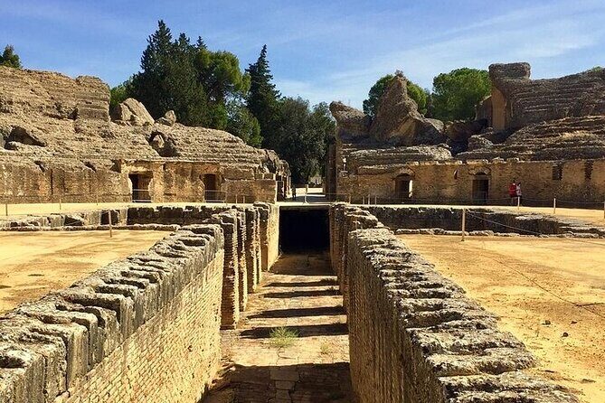 Private hald day tour to the historic roman city of Italica - Entering the Anfiteatro de Italica (With Mosaics in View)