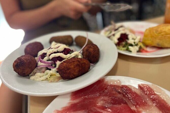 Private Seville Flamenco & Tapas Experience - Santa Cruz tapas with a private guide: taste first, then understand why