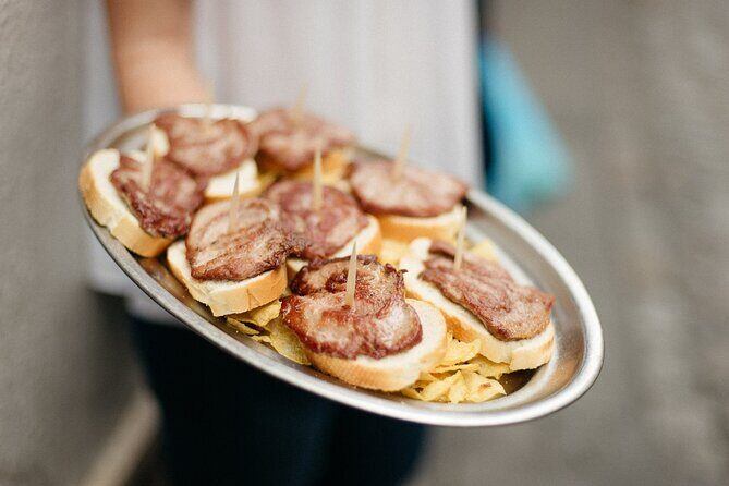 Private Seville Tapas & History Tour - Las Golondrinas (Pagés del Corro): Iberian Pork Loin and a Local Red Wine Twist