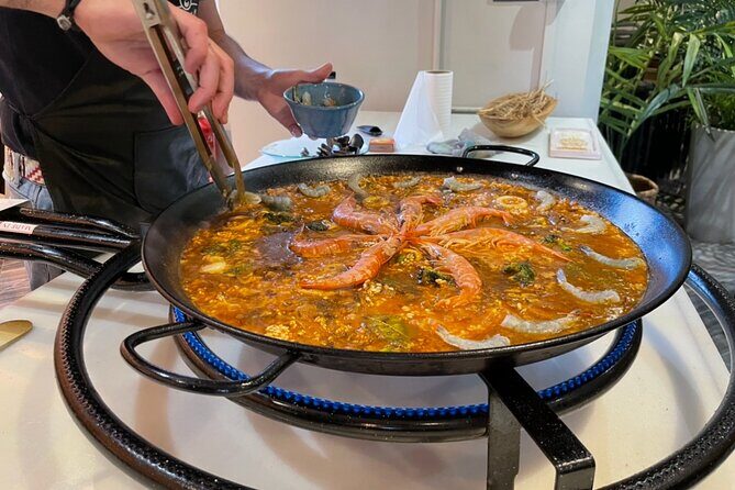 Sangria Tasting & Paella Showcooking Experience - Rooftop Views First: Where the Sangria and Paella Happen