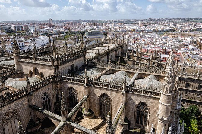 Seville Guided Tour into Alcazar and Cathedral Skip the Line - Giralda Tower: From Mosque Minaret to Cathedral Bells
