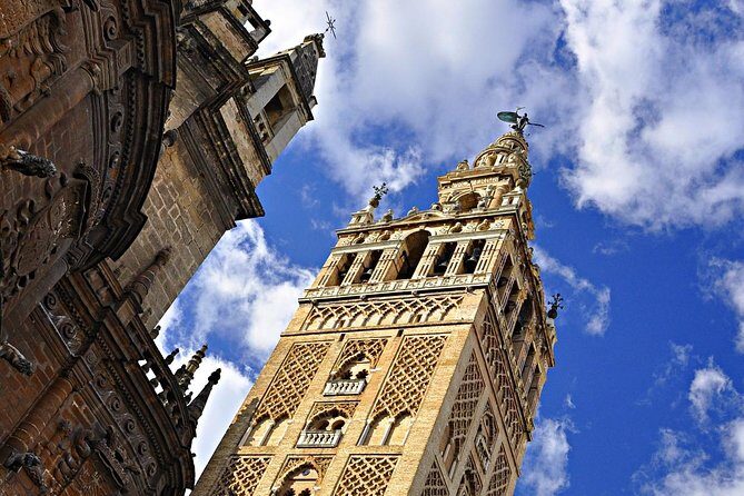 Seville Guided Tour into Alcazar and Cathedral Skip the Line - Seville Cathedral: Gothic Scale With Real Context