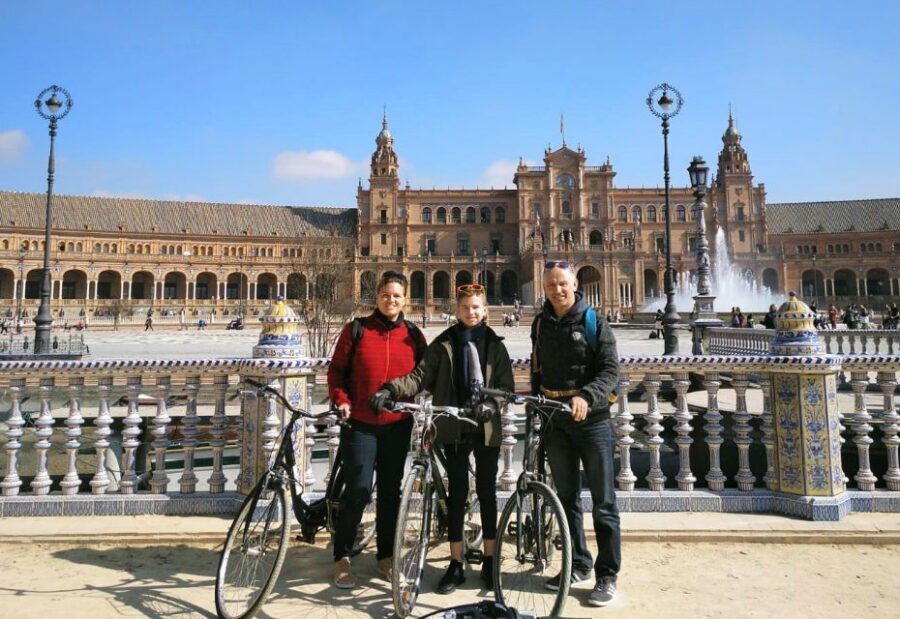 Seville: Highlights Bike Tour with Local Guide - Crossing to Old Landmarks: Puente de Isabel II and Torre del Oro