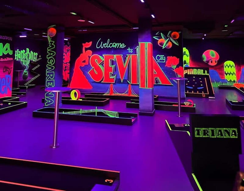 Seville: Indoor UV 18 hole Minigolf Experience - Check-In and Setup: UV Gear, Scorecard, and Kids’ Putters