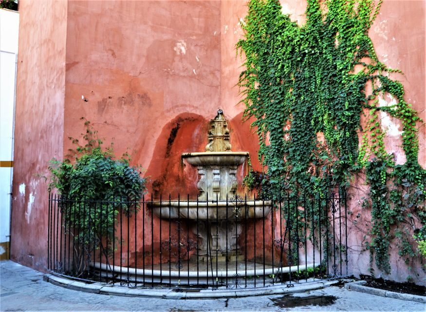 Seville: Plaza de Toros and Barrio Santa Cruz Tour - Museo Taurino highlights: horse yard, chapel, and the ring