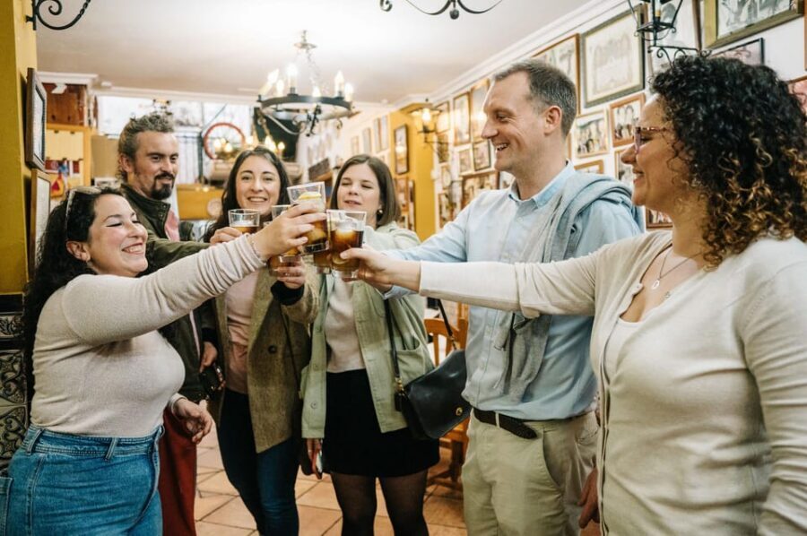 Seville: Private Tapas & History Tour in Triana Neighborhood - Stop 3: Freiduría Reina Victoria and adobo fish tied to the April Fair