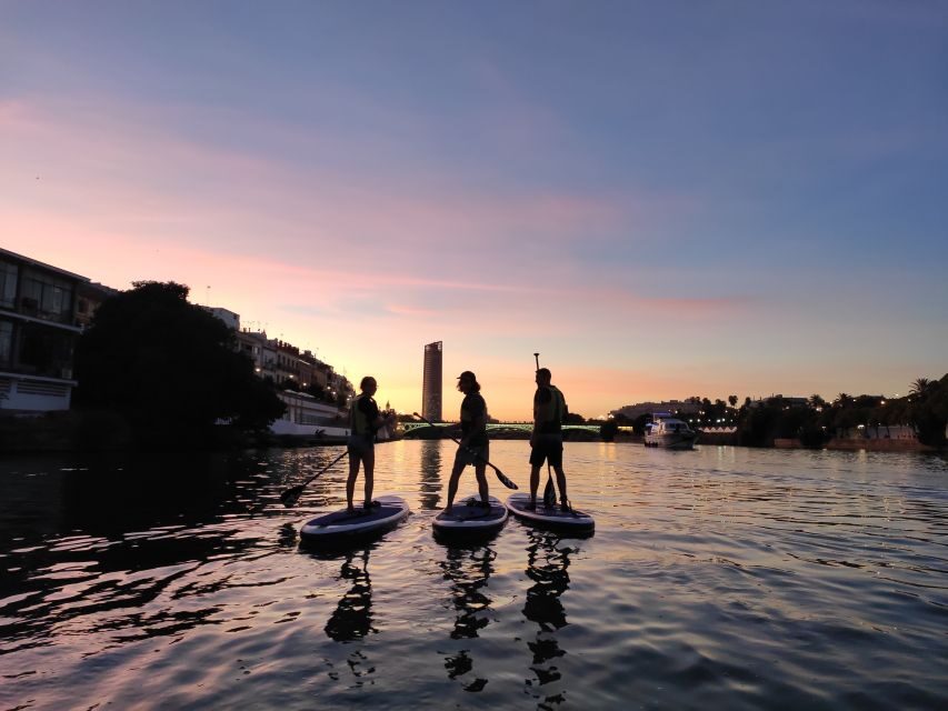 Seville: Sunset and Evening Paddle Boarding Tour - The river route: San Telmo to Cachorro and back on the other side