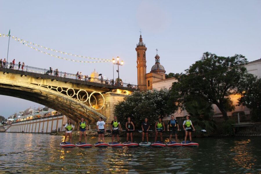 Seville: Sunset and Evening Paddle Boarding Tour - Meeting at C. Betis 19: getting geared up fast