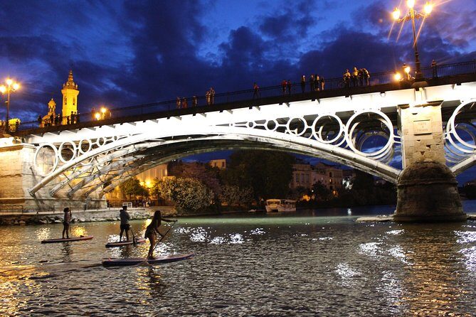 Seville: Sunset in Paddle Surf - The Landmark Route: Torre del Oro to the Puentes of Seville