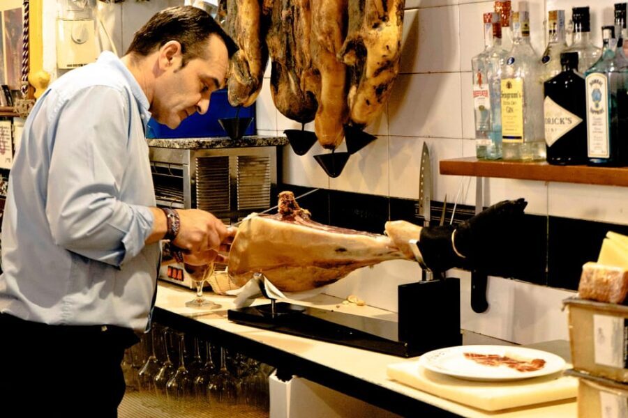 Seville: Wine and Gourmet Tapas Tour - Stop 1: bodega tapas with wine and Seville dish context