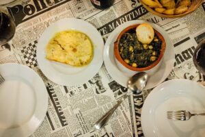Triana Gourmet Tapas Tour in Seville - What you eat and drink: shared tapas, included beverages, and dessert